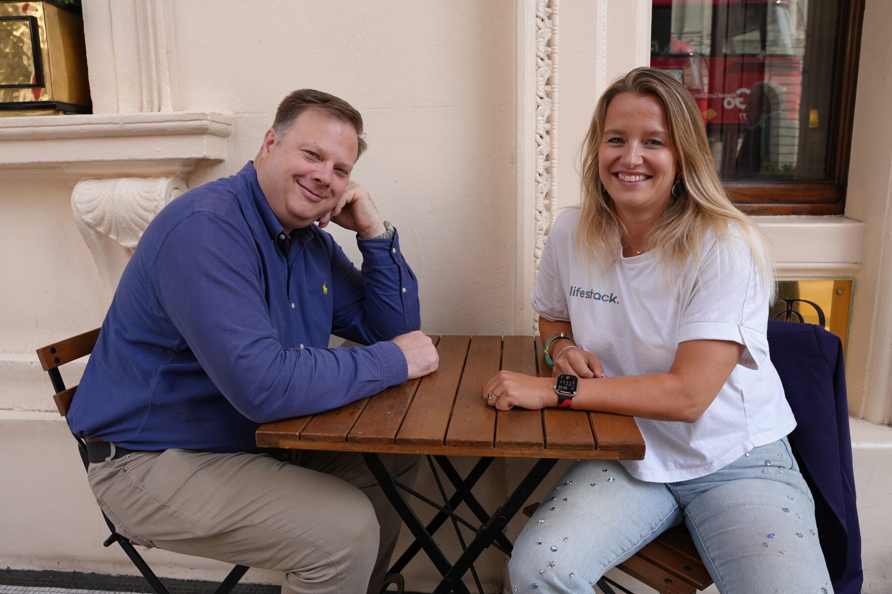 Steven and Claire, founders of lifestack, talking at a cafe table