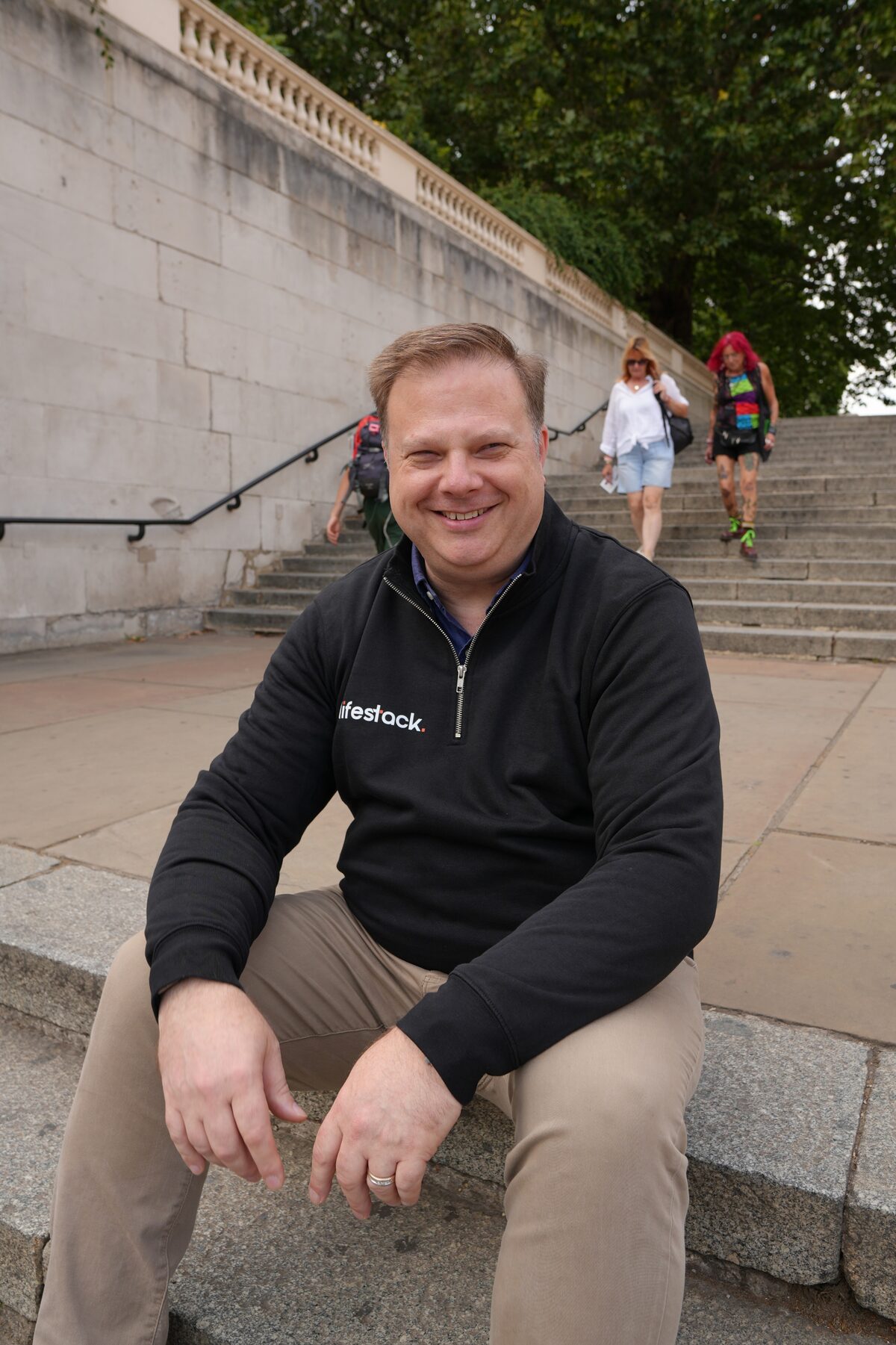 Steven Bianchi, co-founder of lifestack, sitting on stone steps